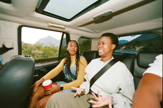 Friends Enjoying a Road Trip in an SUV