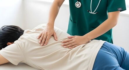 Obraz premium A medical professional performing a back examination on a patient lying face down on an exam table