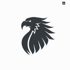 Obraz premium Stylized eagle head silhouette logo design for business and branding