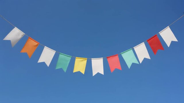 Colorful Pennant Bunting Flags Hanging Against A Clear Blue Sky