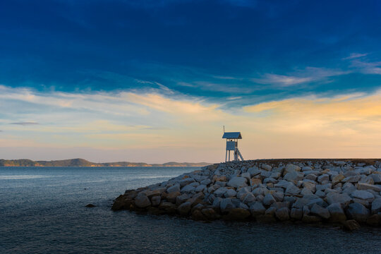 sunrise seascape with tower observation old small Located , in the khao laem ya - mu ko samet National Park ,Thailand.