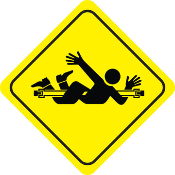 Entanglement hazard warning sign with yellow diamond shape and black pictogram of person caught in rotating shaft