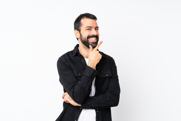 Fototapeta premium Young man with beard over isolated white background smiling