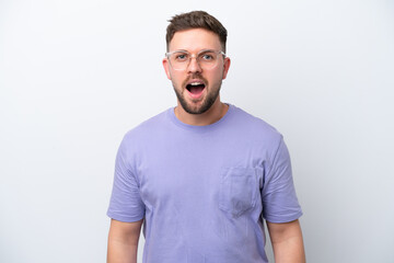 Obraz premium Young caucasian man isolated on white background with surprise facial expression