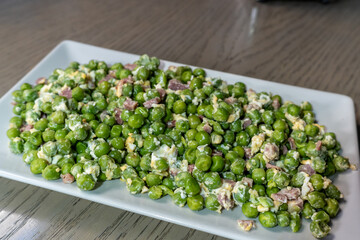 Traditional Green Peas Cooked with Ham and Eggs