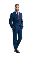 Successful businessman standing with hands in pockets