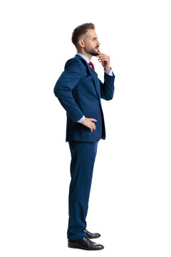 Side view of thoughtful businessman touching chin