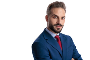 Ambitious businessman in blue suit posing