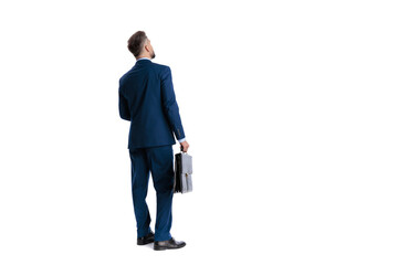 Fototapeta premium Ambitious man in suit standing back view holding briefcase