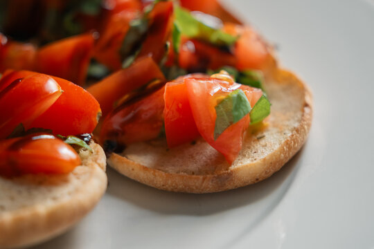 Close up of bruschetta with chopped tomatoes and basil