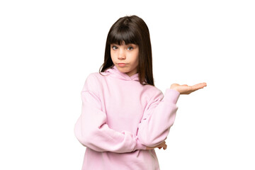 Little girl over isolated green chroma key background having doubts