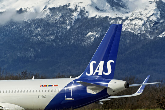 Geneva, Switzerland - February 22, 2026 :: signs and logotype on the fuselage and tail on an airplane of SAS Scandinavian airlines on the runway of Geneva AirportGeneva, Switzerland - February 22, 202