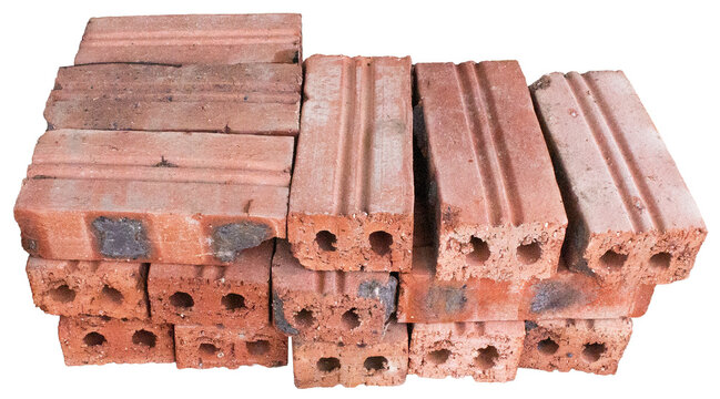 Stack Of Weathered Red Clay Hollow Bricks Used For Traditional Construction Building Material