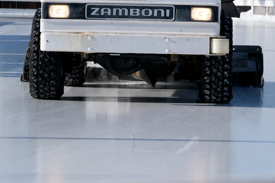 Zamboni glides smoothly over the sparkling ice at a local rink