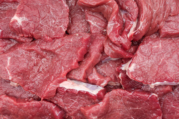 Fresh raw red beef pieces with clearly visible texture
