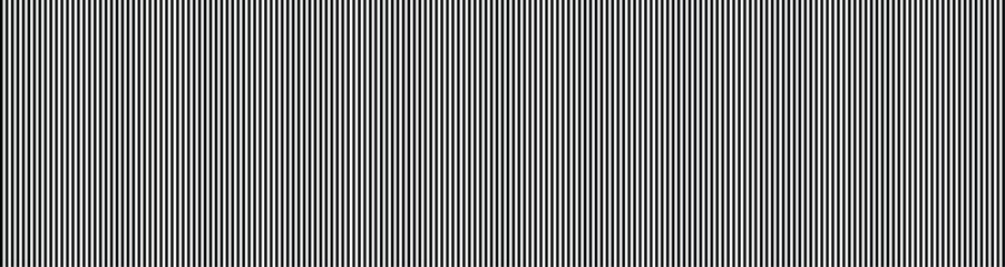 Obraz premium A seamless pattern of closely spaced thin white lines on a gray background texture