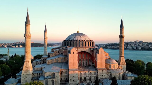 The Hagia Sophia, a historic mosque and former cathedral, stands majestically in Istanbul at sunset.
