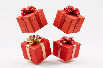 Obraz premium Four red gift boxes with bows levitating on white background.