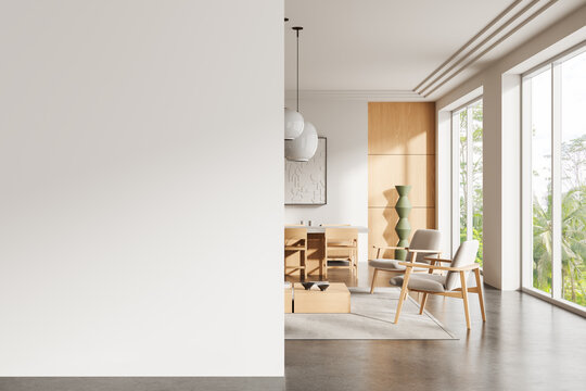 Modern interior with empty white wall for poster mockup and stylish wooden furniture in clean minimalist living room with natural light view.. 3D Rendering
