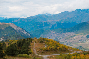 Fototapeta premium Autumn Trekking Path in Svaneti Georgia, Scenic Mountain Landscape from Mestia to Ushguli via Zhabeshi and Adishi, Nature Adventure Concept