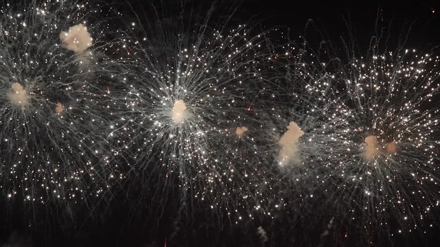 Amazing real beautiful colorful fireworks background on celebration night event for happy new year party or independence day, Abstract Multi color golden firework in the night sky