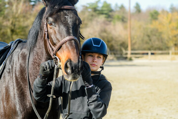 Portrait of a beautiful rider and her horse