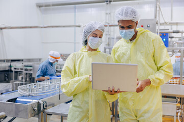 Food hygiene inspector team work examination food production process in line at cannery food factory
