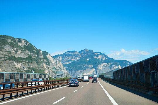 transit route through italy, highway with cars and camper vans