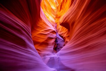 Dramatic canyon landscape with vibrant red rock formations and warm sunlight