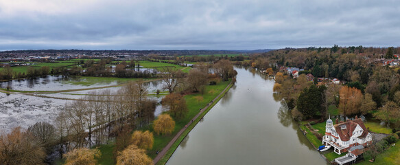 Naklejka premium Aerial photograph of Caversham Heights in Reading, UK, showing residential housing, river thames greenery, and suburban streets from an elevated drone perspective in a suburban English neighborhood.