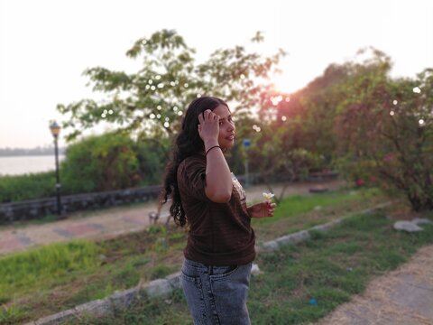 young woman walking in the park