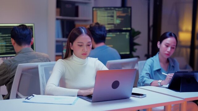 Dedicated business financial planning advisors collaborate late at night in a modern office, brainstorming creative budget solutions, analyzing investment strategies, and developing goal oriented plan