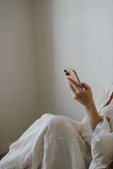 Calm Digital Lifestyle With Woman Using Phone In Minimal Home Interior And Soft Tones