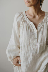 Neutral Outfit Close Up Featuring Relaxed Linen Tunic And Simple Modern Styling