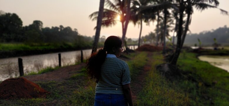 young women walking at sunset location
