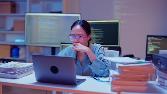 Asian female smart programmer works late night office coding deep learning AI models, training neural networks with intense concentration and focus, dedicating overtime hours alone to machine learning