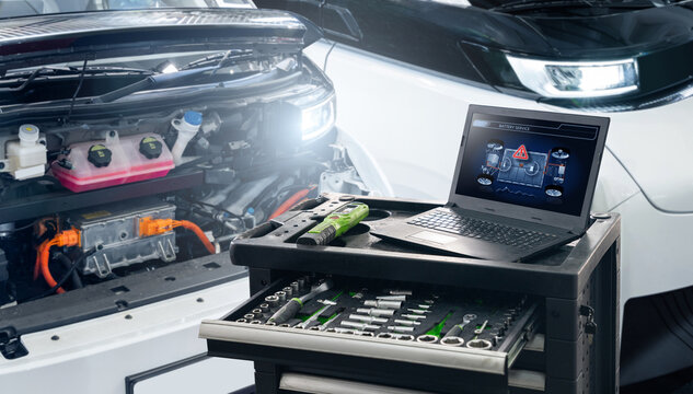 Checking the battery pack of an electric car at a service center