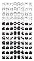 Fototapeta premium Four black paw prints arranged on a white background showcasing animal track impressions