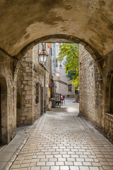 Narrow Stone Archway and Cobblestone Alley in Saint-Paul-de-Vence