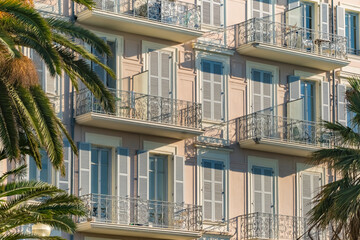 Classic French Riviera Architecture with Pastel Facade and Balconies