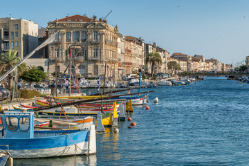 Colorful boats and historic waterfront architecture in Sete France