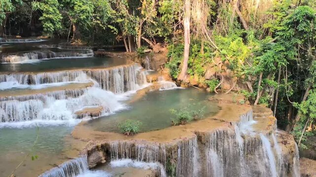 flowing water stream creek cascade waterfall in tropical forest