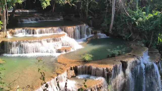flowing water stream creek cascade waterfall in tropical forest