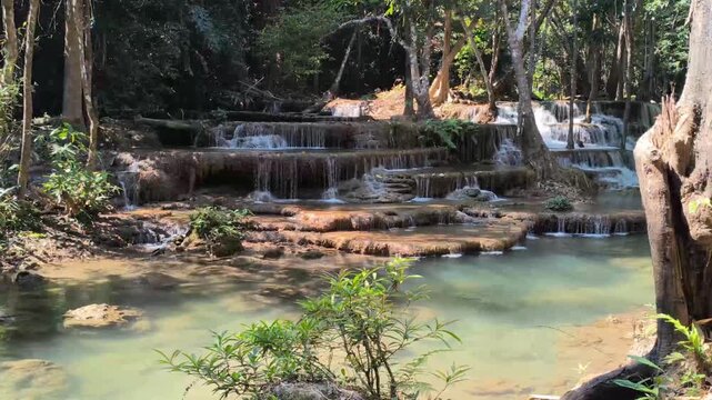 flowing water stream creek cascade waterfall in tropical forest