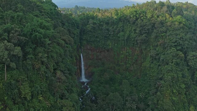 Dramatic aerial view of kapas biru waterfall in java
