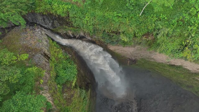 Aerial top down view of kabut pelangi waterfall in java