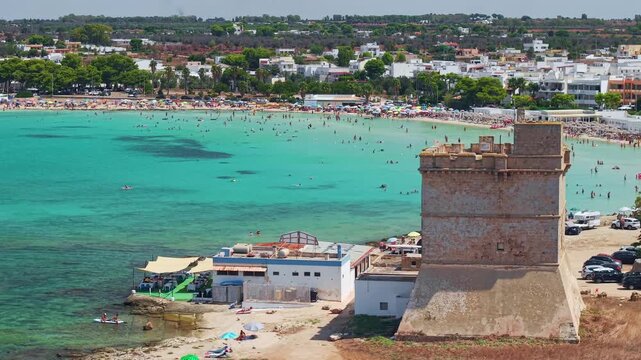 Aerial view of Torre Sant'Isidoro watchtower and beach in Nardo, Puglia, Italy.