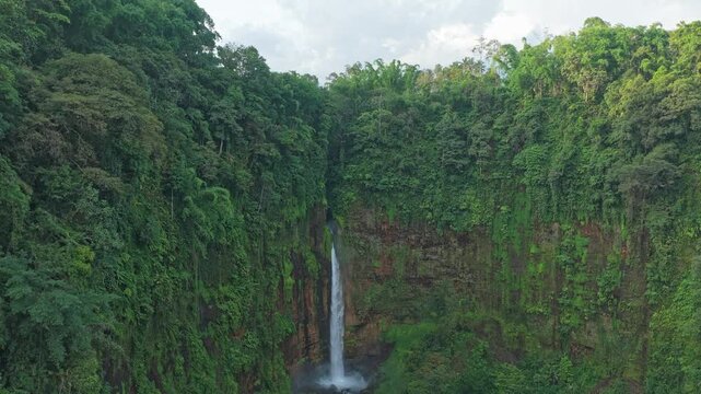 Aerial view of kapas biru waterfall in tropical rainforest