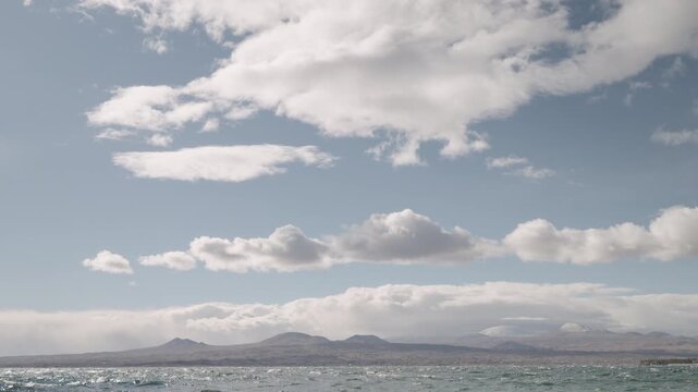 Slow motion handheld footage of lake Sevan in Armenia windy autumn season