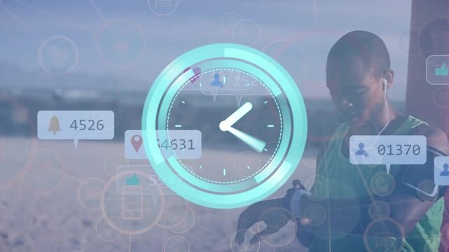 Animation of clock with icons over african american man using smartwatch